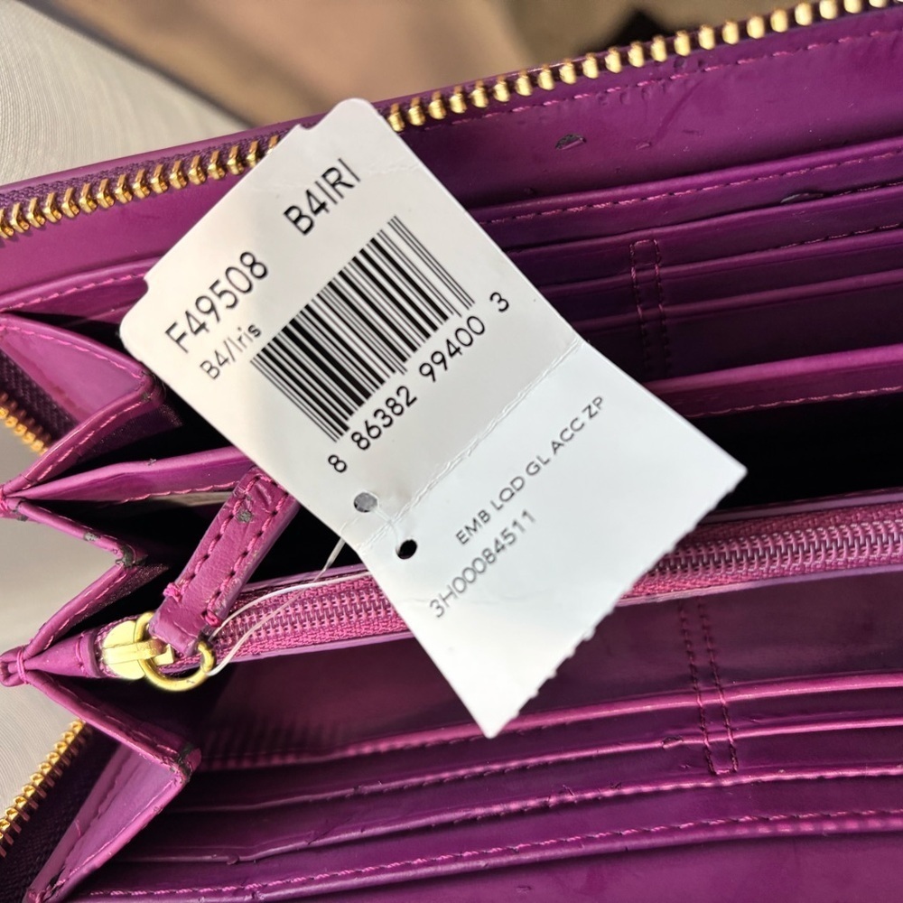 Coach F49508 Patent Signature Iris Purple Long
Bow Heart Zip Wallet (2012-2013) - Picture 9 of 12